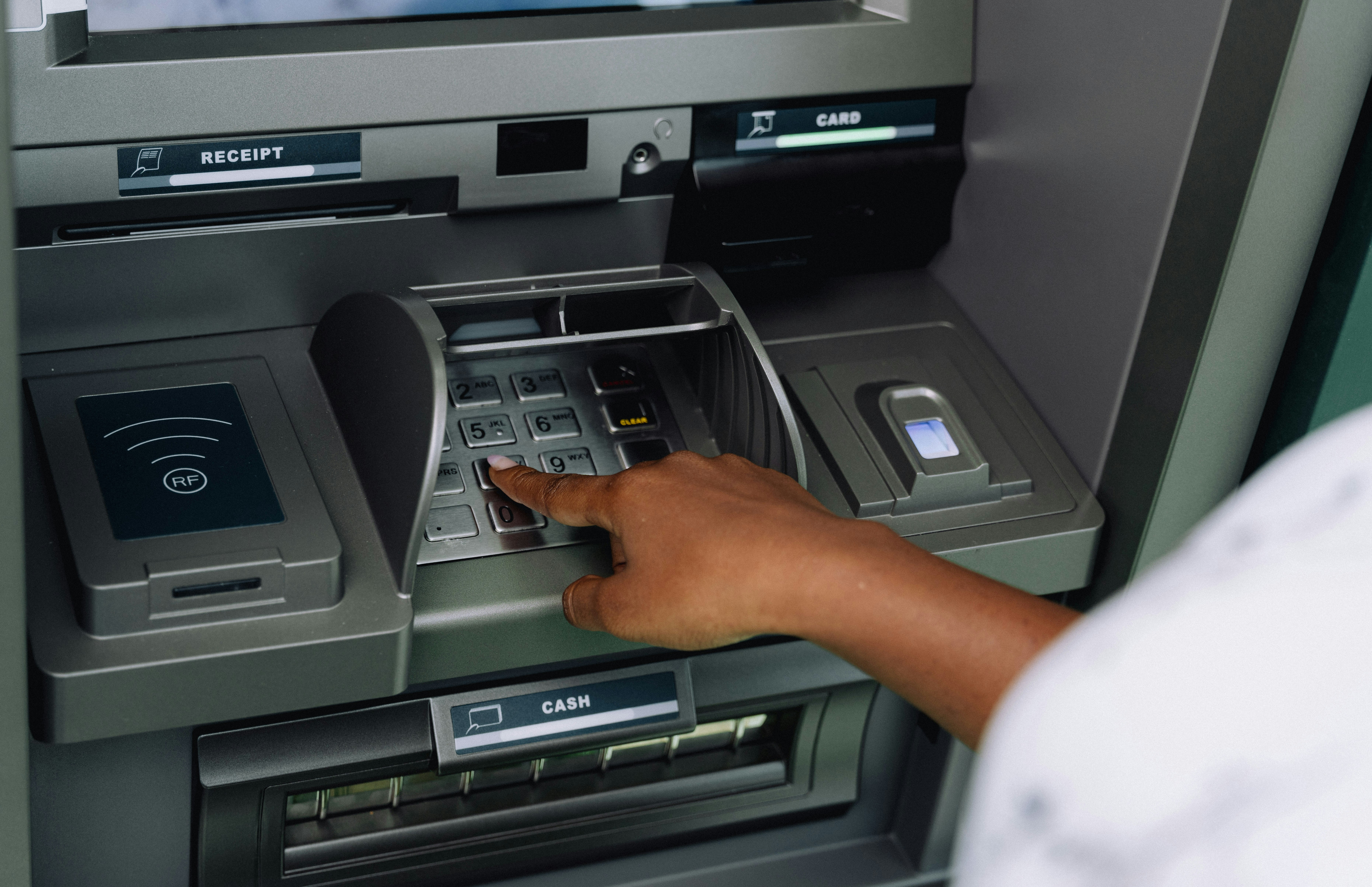 Person Using ATM