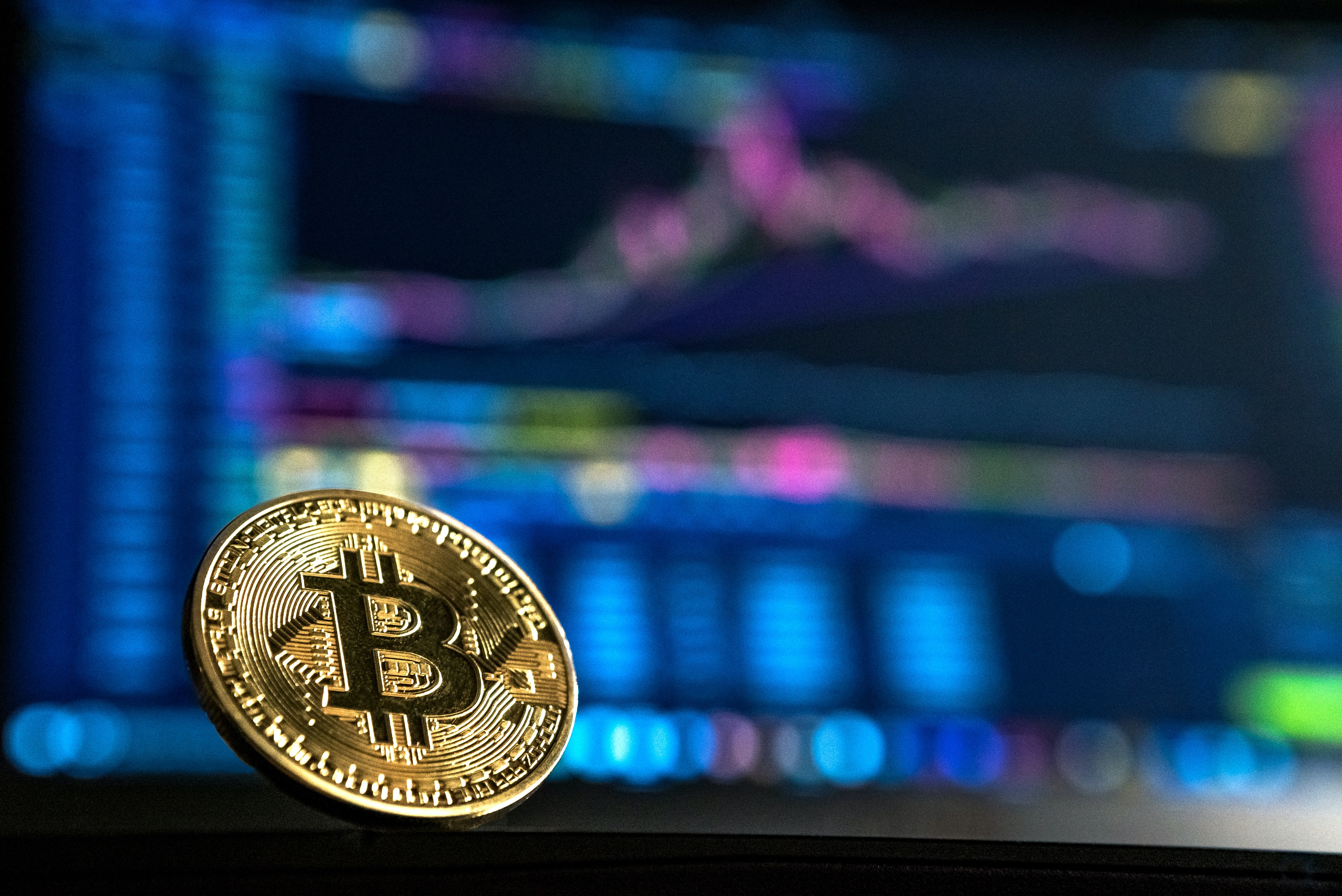 Gold Bitcoin with Neon Dashboard blurred in Background