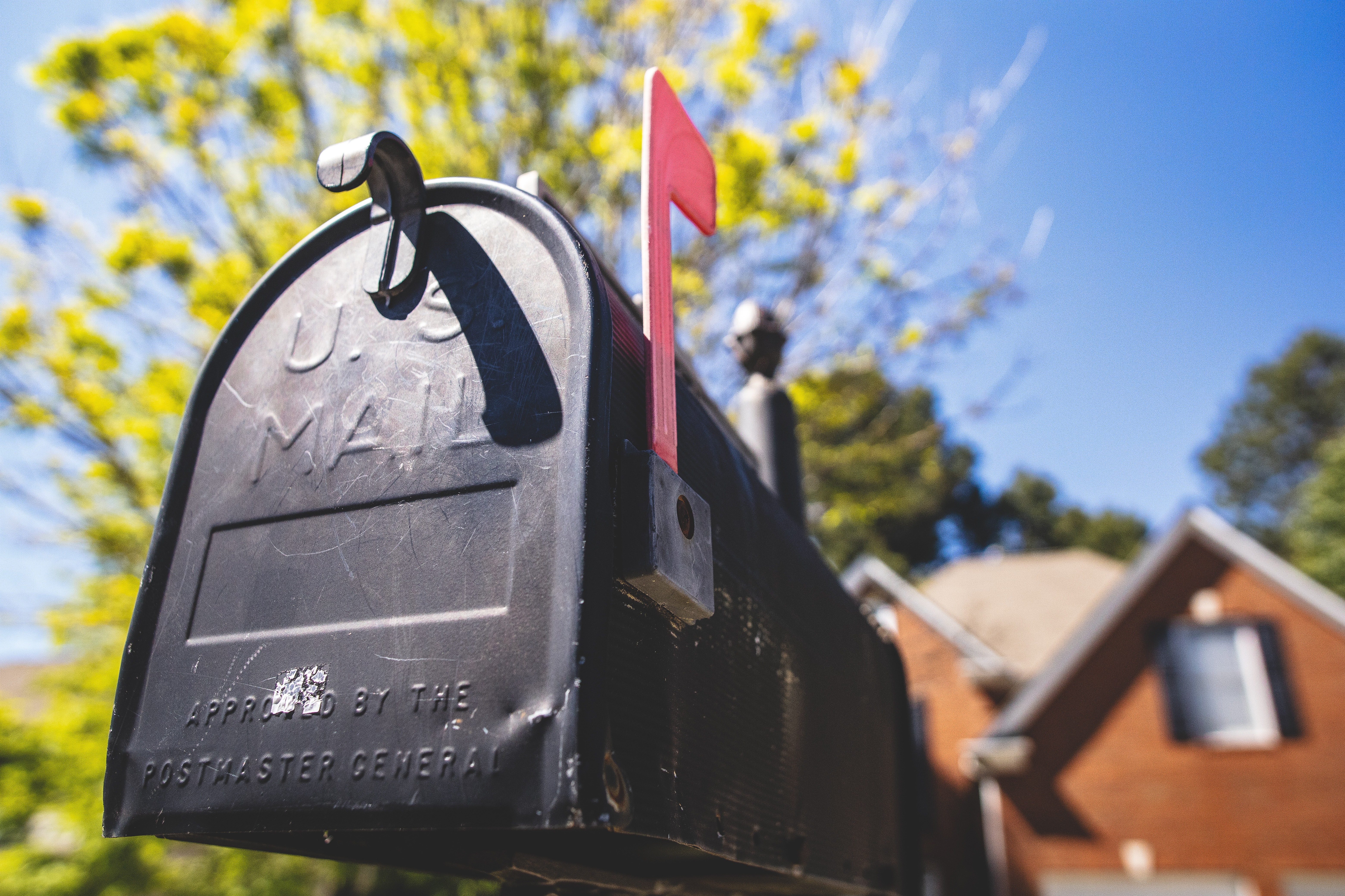 Black Mailbox with Red Flag Up