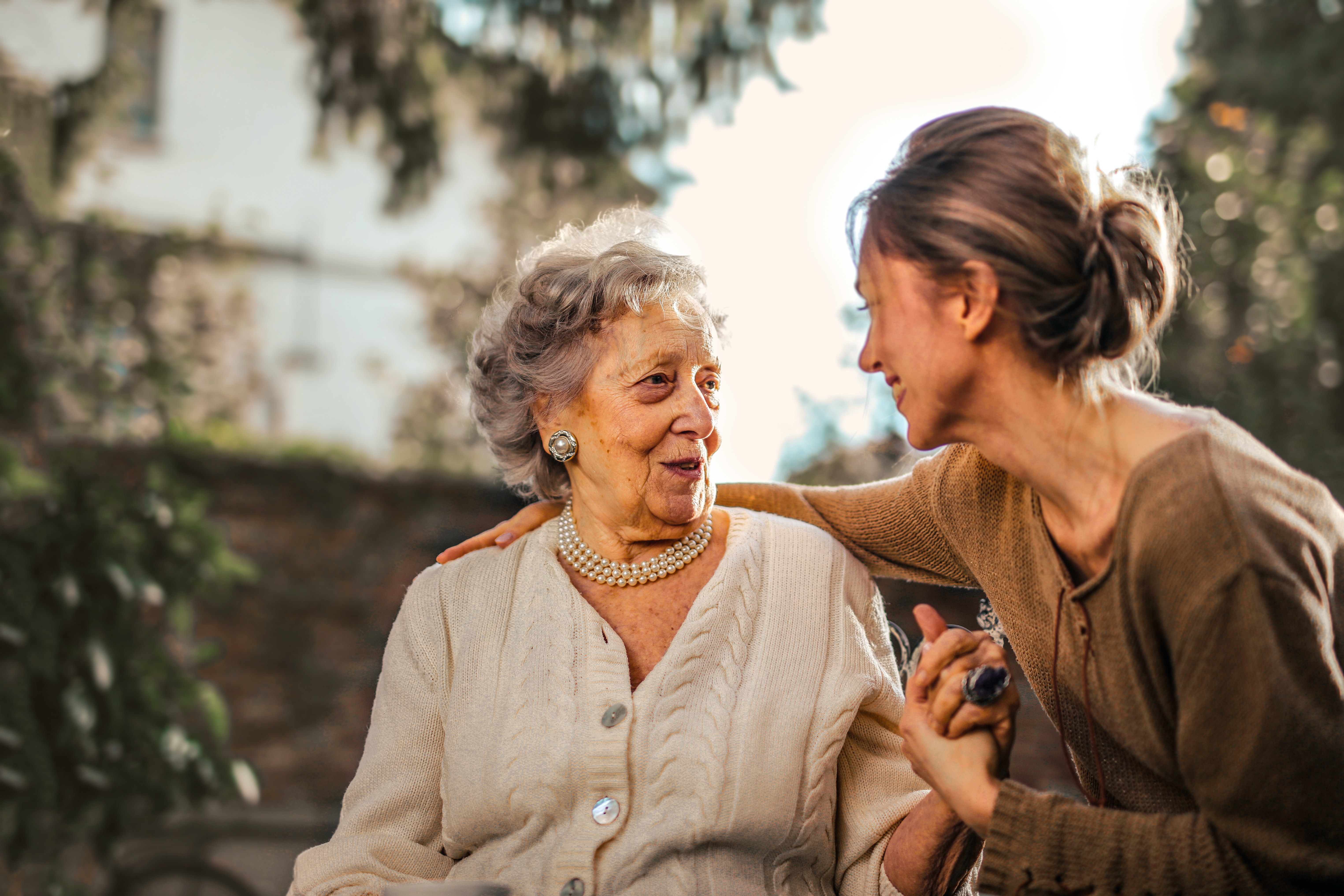 Elderly woman with younger woman caretaker