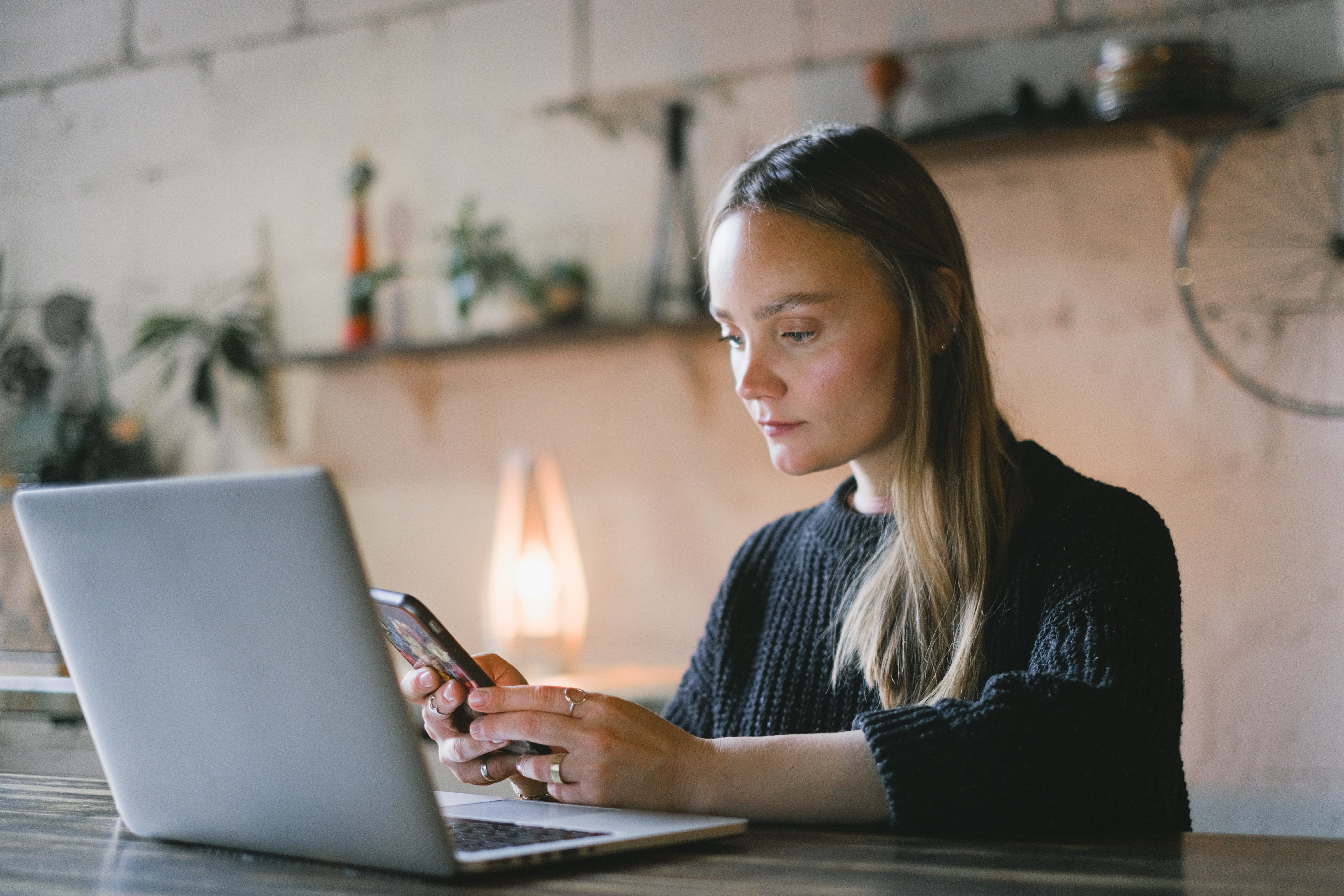 Young Woman on Laptop and Phone