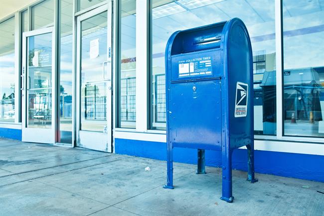 Mailbox Phishing Scams Blue Mail Collection Box in front of Glass Windows