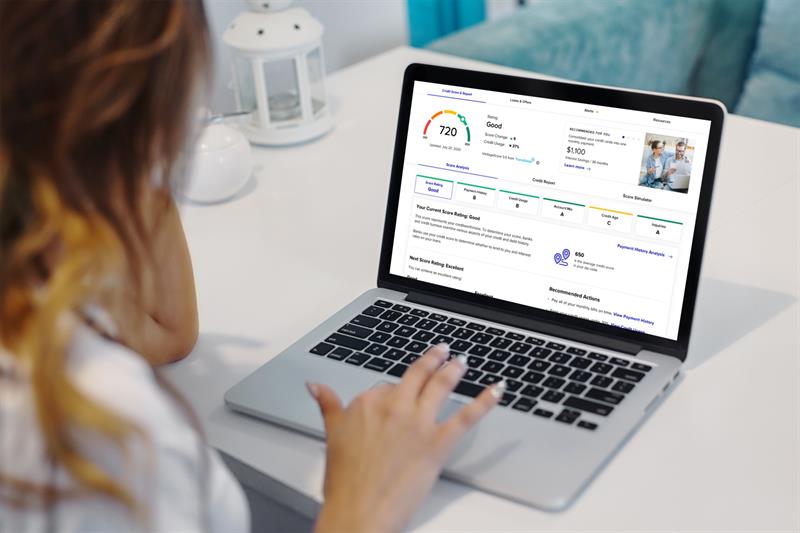 Credit Aware Powered by SavvyMoney on Laptop A person using a computer