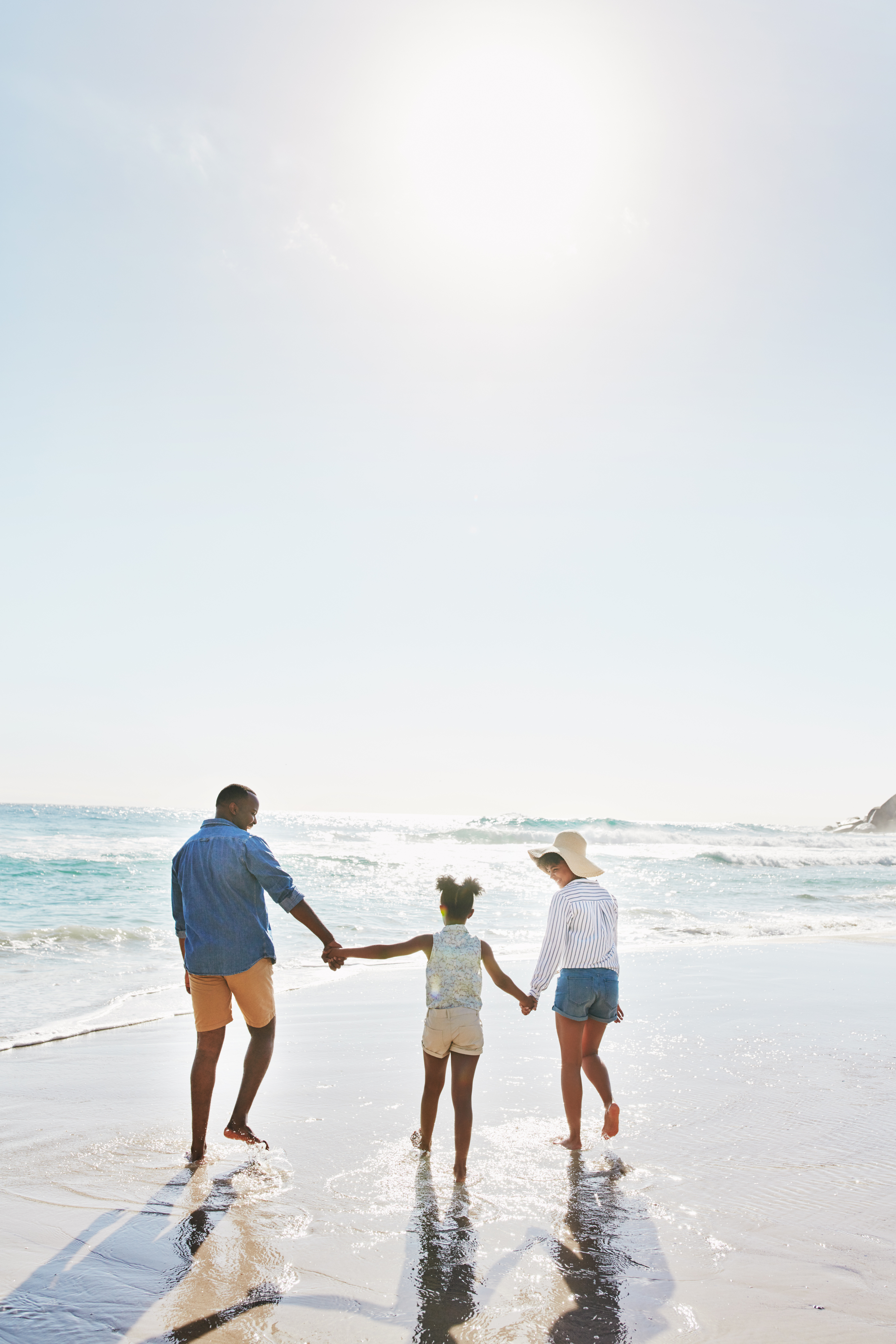 Family Holding Hands at Beach